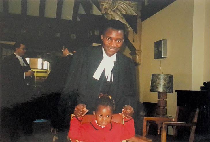 Sebastien celebrates with his daughter after being called to the bar in September 2001