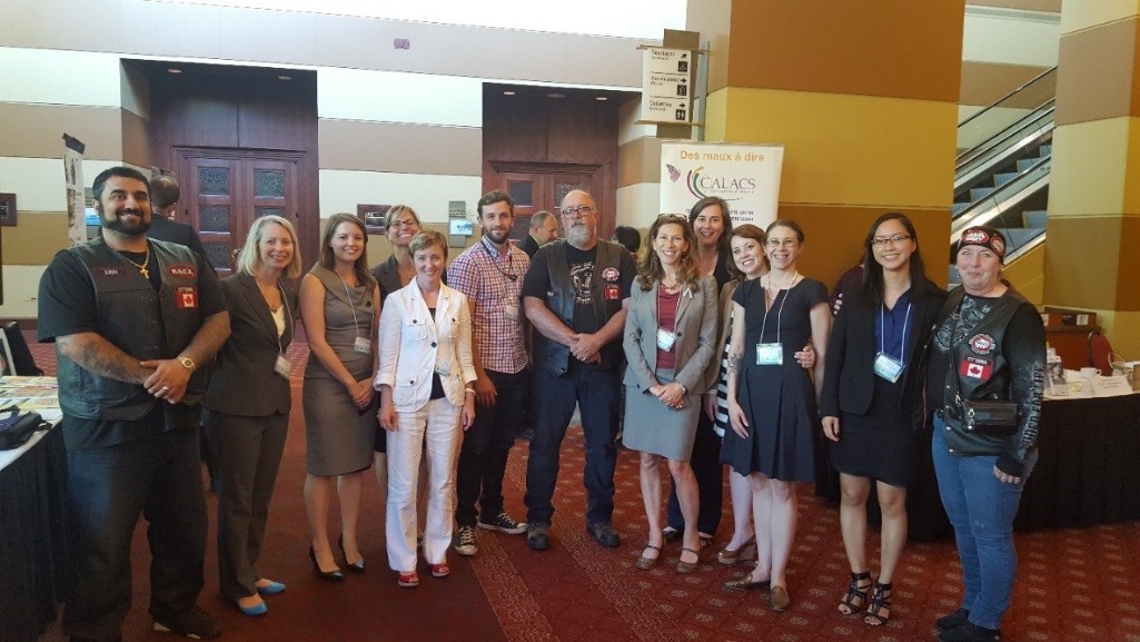 Policy Centre for Victim Issues Team pictured with members of Bikers Against Child Abuse, which hosted a kiosk at the Victims and Survivors of Crime Week Symposium on June 3, 2016.
